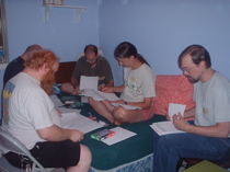 The team looks over the puzzles at the start of the party