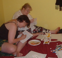 Janet and Kaaren take notes on the structure