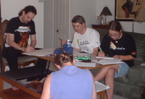 The team sits around the table, 45 minutes into the game